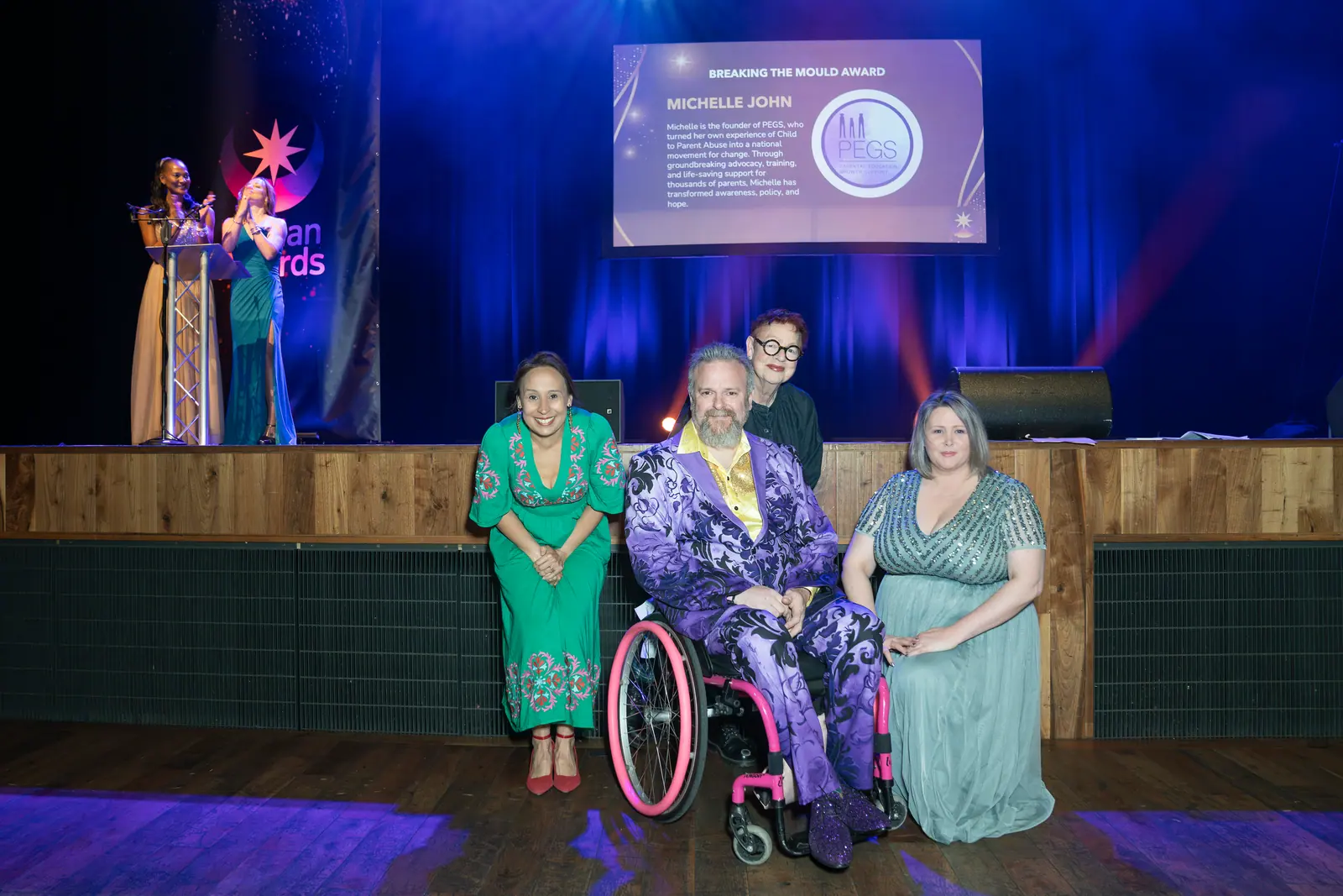 Michelle John of PEGS on stage receiving the Breaking the Mould Award.