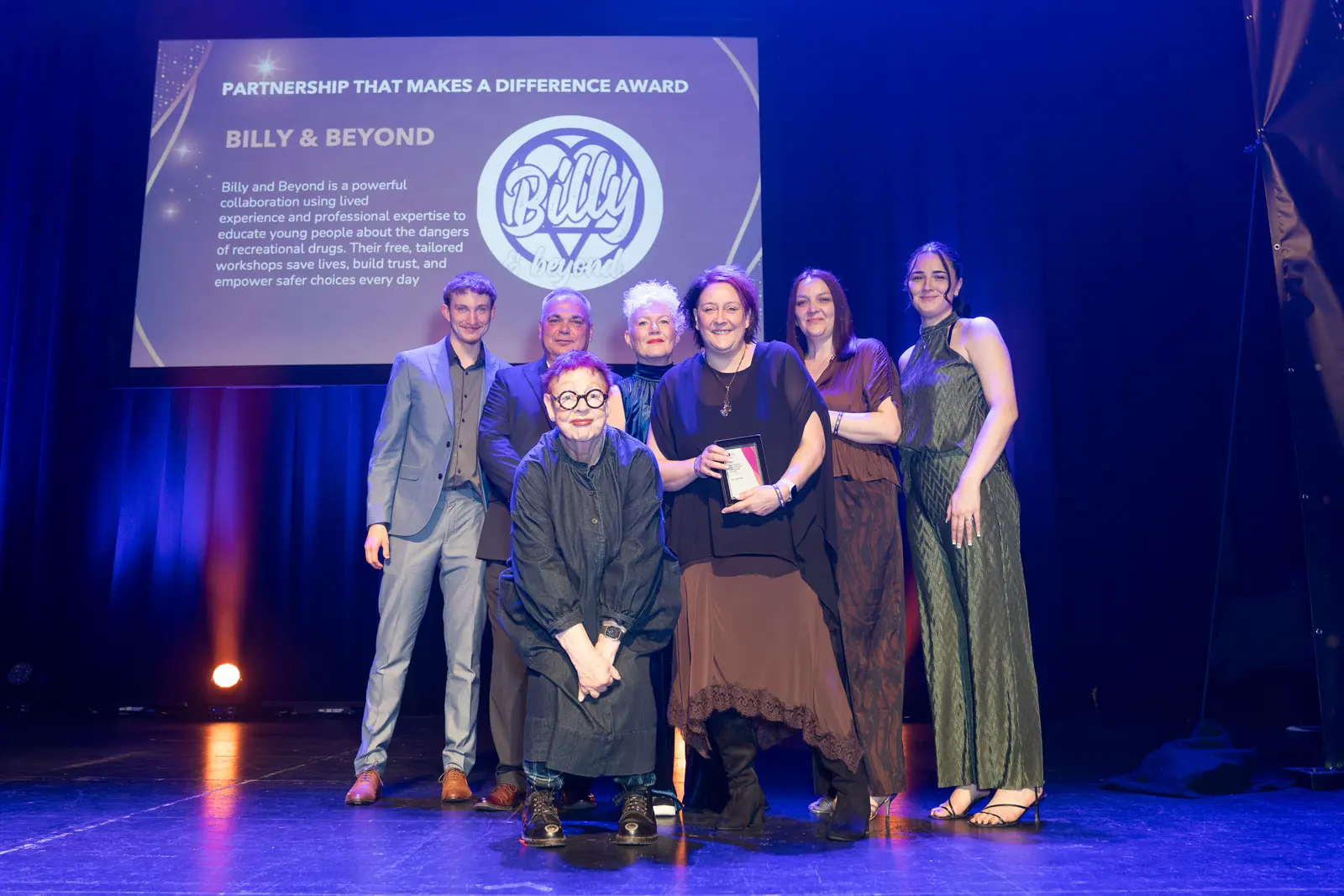 The Billy and Beyond team on stage receiving the Partnership That Makes a Difference Award.