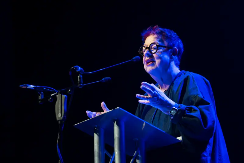 Jo Brand gesturing as she introduces the next award.