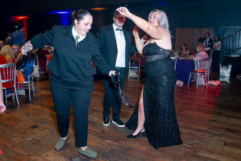 Guests dancing together on the ballroom floor.