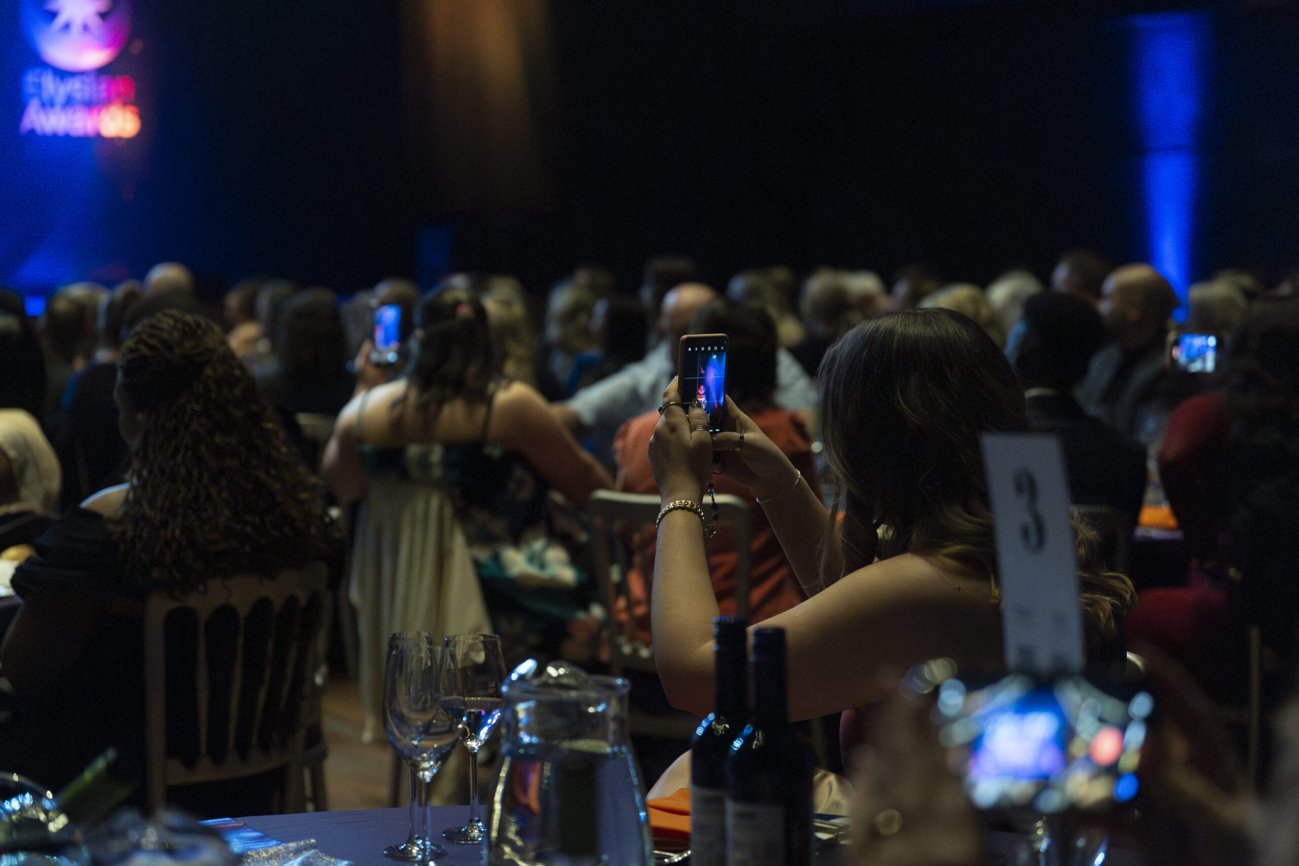 Guest taking a picture of the stage at the Elysian Awards 2026
